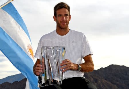 Mar 18, 2018; Indian Wells, CA, USA; Juan Martin Del Potro poses with the championship trophy after defeating Roger Federer (not pictured) in the men's finals in the BNP Paribas Open at the Indian Wells Tennis Garden. Mandatory Credit: Jayne Kamin-Oncea-USA TODAY Sports