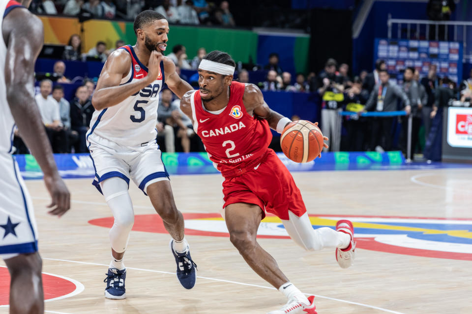 Canada's Shai Gilgeous-Alexander and the United States' Mikal Bridges battle during the bronze-medal game of the 2023 FIBA Basketball World Cup at the Mall of Asia Arena in Manila, Philippines. (Photo by Nicholas Muller/SOPA Images/LightRocket via Getty Images)