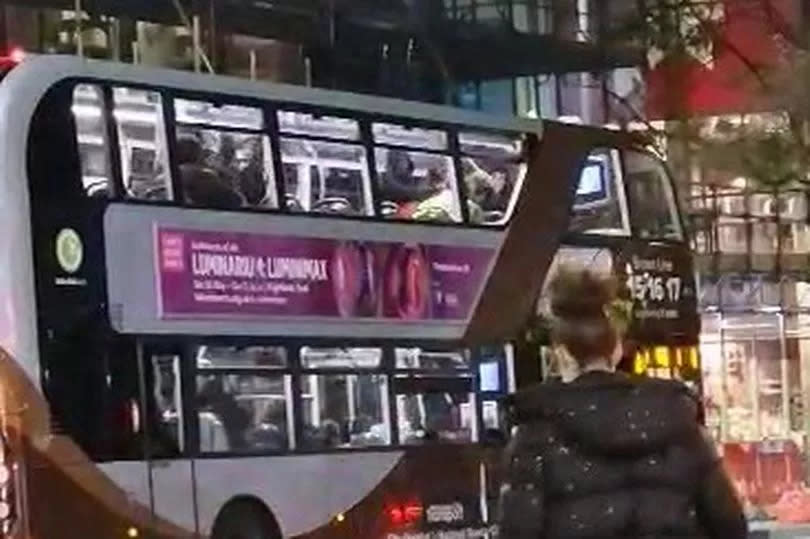 Screengrab of the fight onboard the bus. Taken from across the street