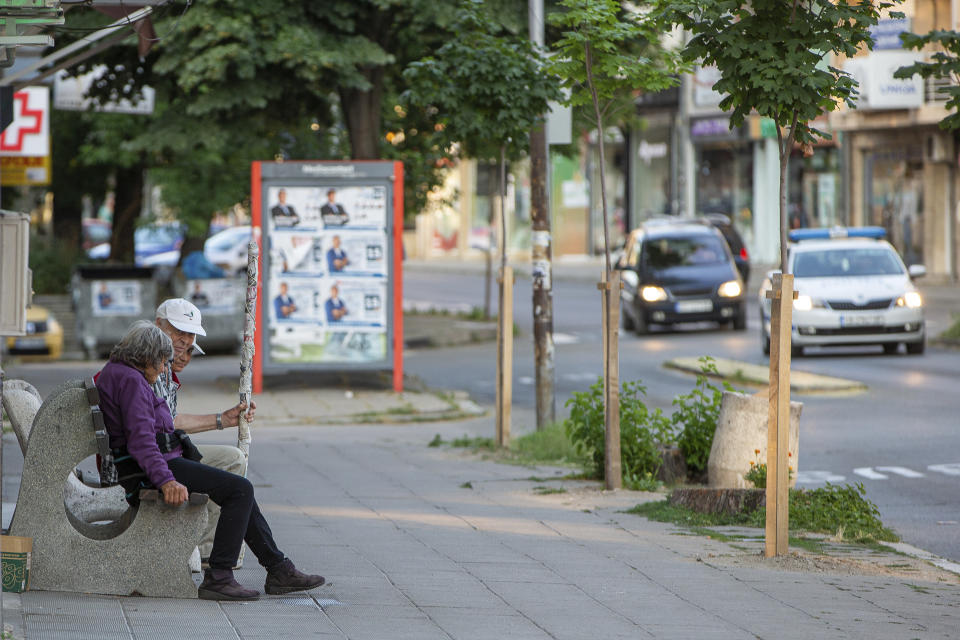 An elderly couple rests on a bench near election posters in the town of Kjustendil, Bulgaria on Friday, July 9, 2021. Voters are going to the polls in Bulgaria for the second time in three months this weekend after no party secured enough support in an April parliamentary election to form a government. Former three-time Prime Minister Boyko Borissov’s GERB party performed best in the inconclusive election, but it received only 26 percent of the vote. (AP Photo/Visar Kryeziu)