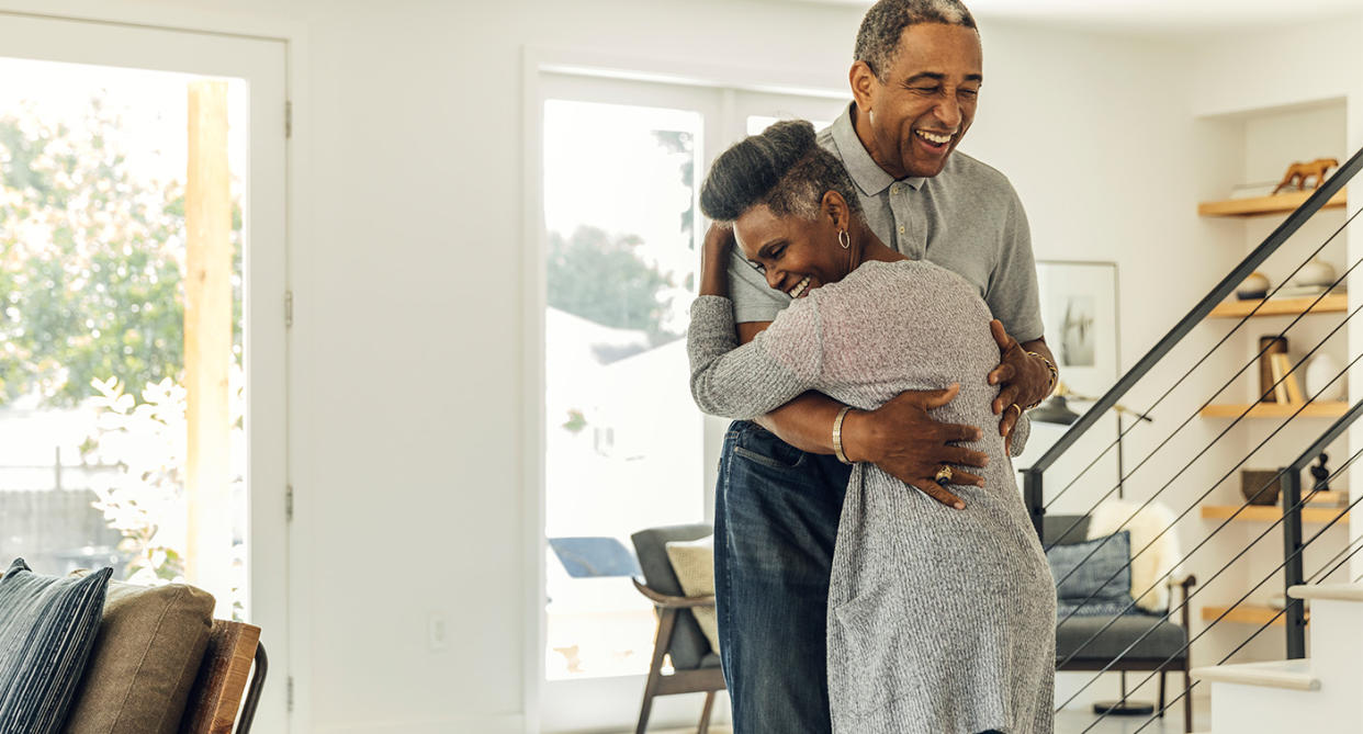 Couple reigniting spark in relationship - dancing in home. (Getty Images)