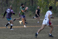 Rugby players of a local club 'Islamabad Jinns' take part in a practice session, in Islamabad, Pakistan, Saturday, Dec. 17, 2022. There is only one sport that matters in Pakistan and that's cricket, a massive money-making machine. But minors sports like rugby are struggling to get off the ground due to lack of investment and interest, stunting their growth at home and chances of success overseas. Even previously popular sports like squash and field hockey, which Pakistan dominated for decades, can't find their form. (AP Photo/Anjum Naveed)