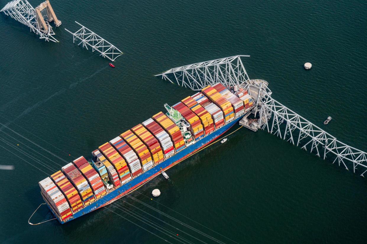 <span>The Dali container vessel after striking the Francis Scott Key Bridge in Baltimore on 26 March 2024.</span><span>Photograph: Al Drago/Bloomberg via Getty Images</span>