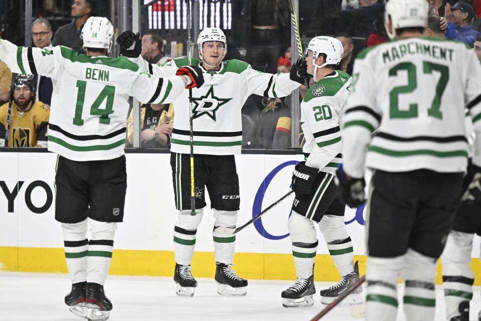 The Dallas Stars celebrate a goal against the Vegas Golden Knights during the third period of an NHL hockey game Saturday, Feb. 25, 2023, in Las Vegas. (AP Photo/David Becker)