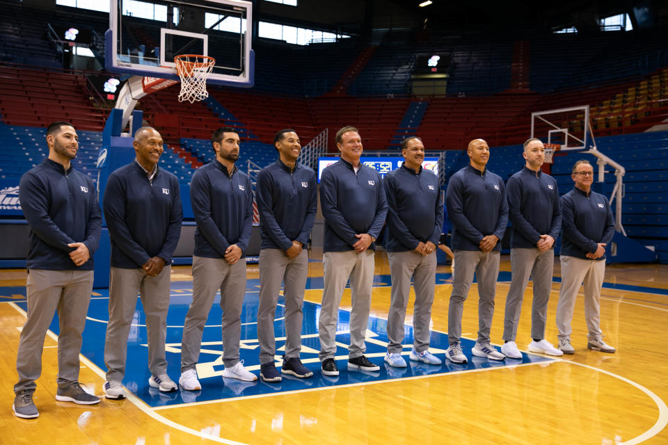 Kansas men's basketball's staff poses for a photo at Allen Fieldhouse on Nov. 2, 2021.