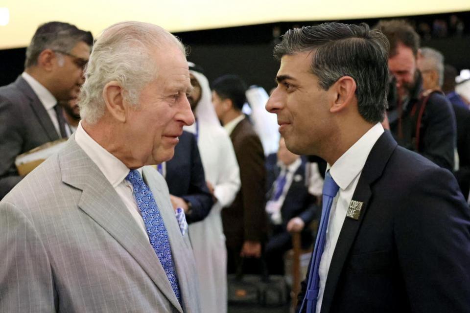 The National: The King, wearing a tie bearing a motif of the Greek flag, speaks to Prime Minister Rishi Sunak as they attend the opening ceremony of the World Climate Action Summit at Cop28 in Dubai (Chris Jackson/PA)