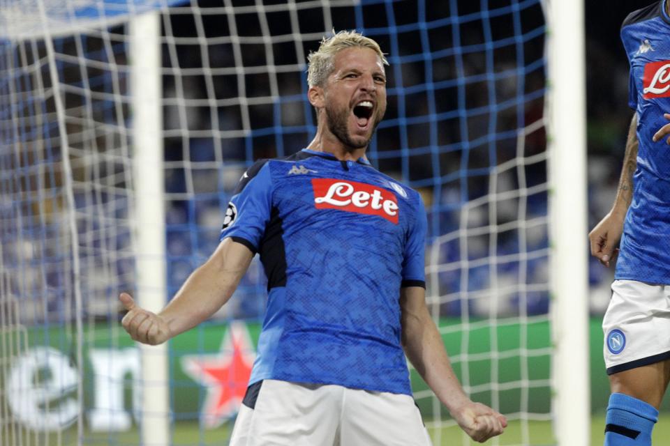 Napoli's Dries Mertens celebrates after scoring the opening goal of his team during the Champions League Group E soccer match between Napoli and Liverpool, at the San Paolo stadium in Naples, Italy, Tuesday, Sept. 17, 2019. (AP Photo/Gregorio Borgia)