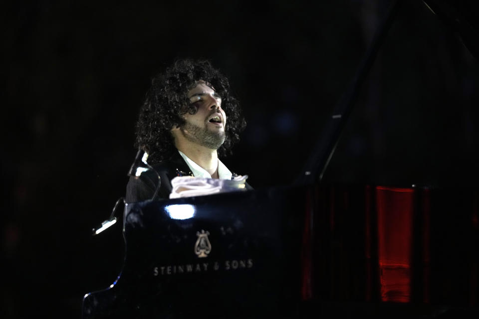 French Pianist Simon Ghraichy performs during a concert in the ancient northeastern city of Baalbek, Lebanon, Sunday, July 17, 2022. Lebanon's renowned Baalbek Festival is back, held in front of a live audience for the first time in two years amid an ongoing economic meltdown. (AP Photo/Hassan Ammar)