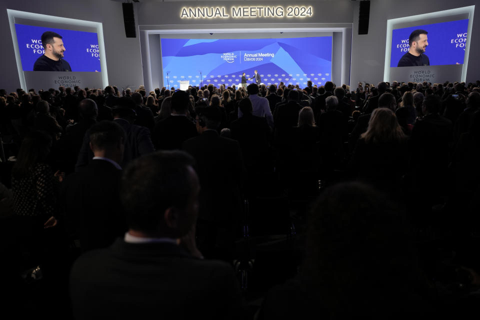 Ukrainian President Volodymyr Zelenskyy gets standing ovations after his speech at the Annual Meeting of World Economic Forum in Davos, Switzerland, Tuesday, Jan. 16, 2024. The annual meeting of the World Economic Forum is taking place in Davos from Jan. 15 until Jan. 19, 2024.(AP Photo/Markus Schreiber)