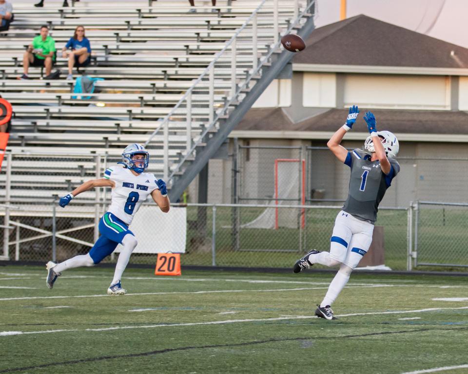 Barron Collier hosted Bonita Springs on Thursday, Sept. 14, 2023. The Cougars won 49-0. Barron Collier's Brody Graham goes up for a catch.