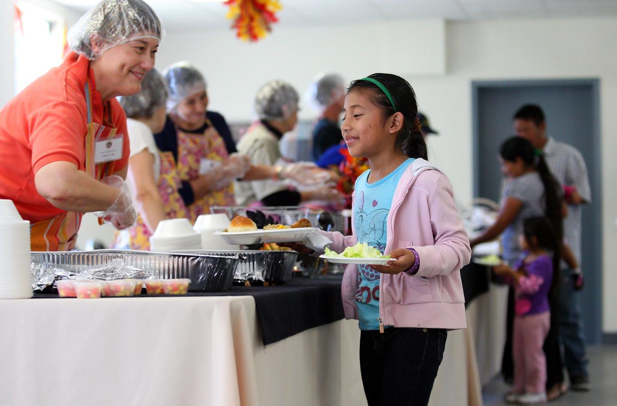Volunteers have helped The Nations Association provide a Thanksgiving dinner at Schandler Community Park in Fort Myers in years past.