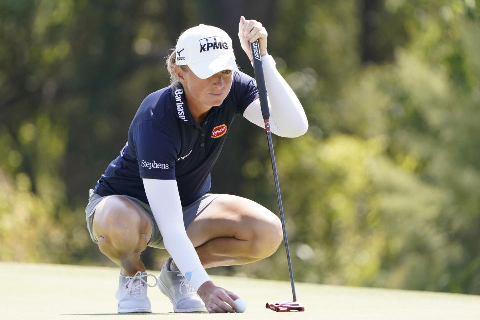 Stacy Lewis lines up a putt on the eighth green during The Ascendant golf tournament in The Colony, Texas, Thursday, Sept. 29, 2022. (AP Photo/LM Otero)