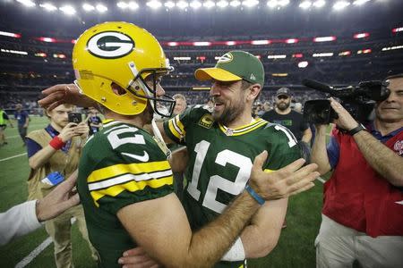 Jan 15, 2017; Arlington, TX, USA; Green Bay Packers quarterback Aaron Rodgers (12) celebrates with kicker Mason Crosby (2) after beating the Dallas Cowboys in the NFC Divisional playoff game at AT&T Stadium. Mandatory Credit: Dan Powers/The Post-Crescant via USA TODAY NETWORK