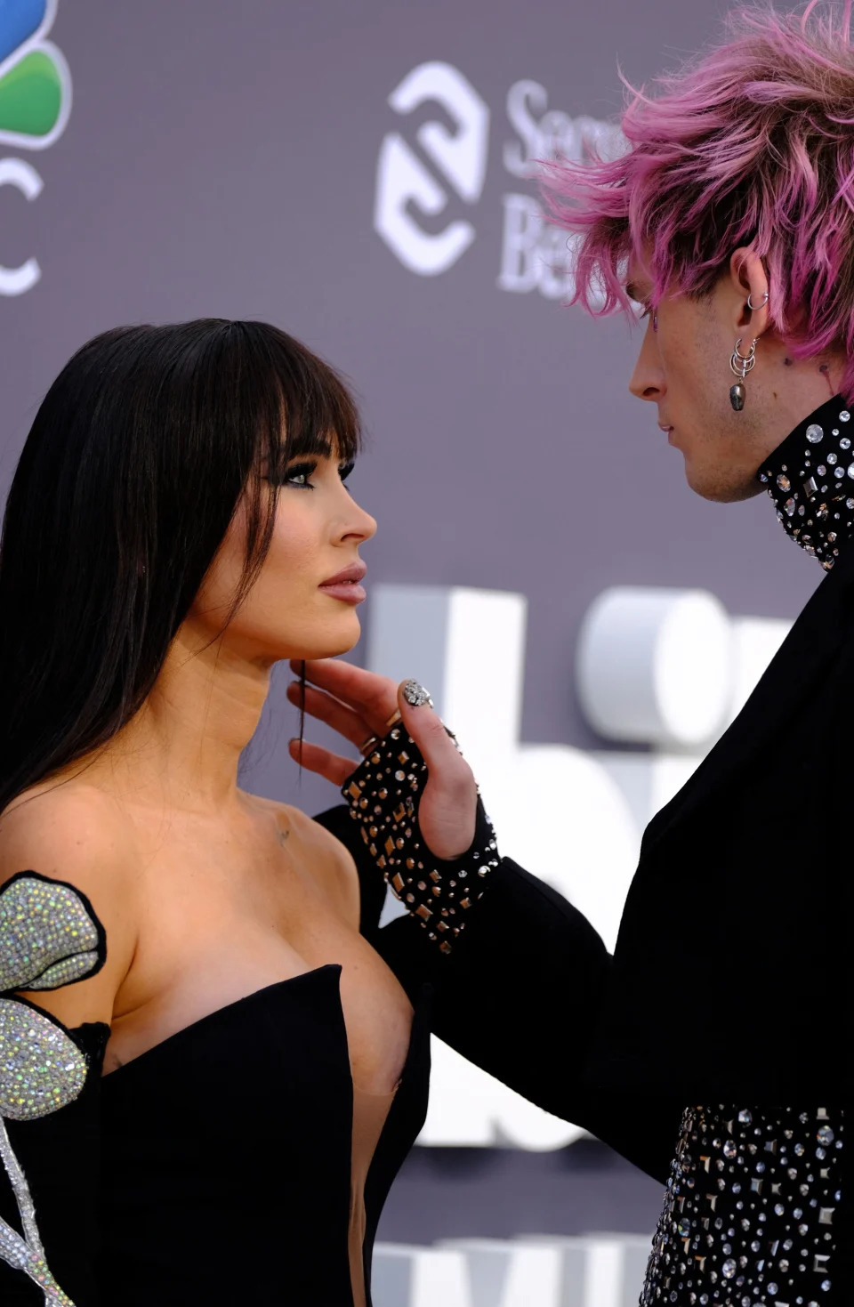 Close-up of Megan and MGK looking at each other