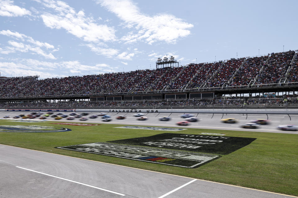 Cars move during a NASCAR Cup Series auto race at Talladega Superspeedway, Sunday, April 21, 2024, in Talladega. Ala. (AP Photo/Butch Dill)