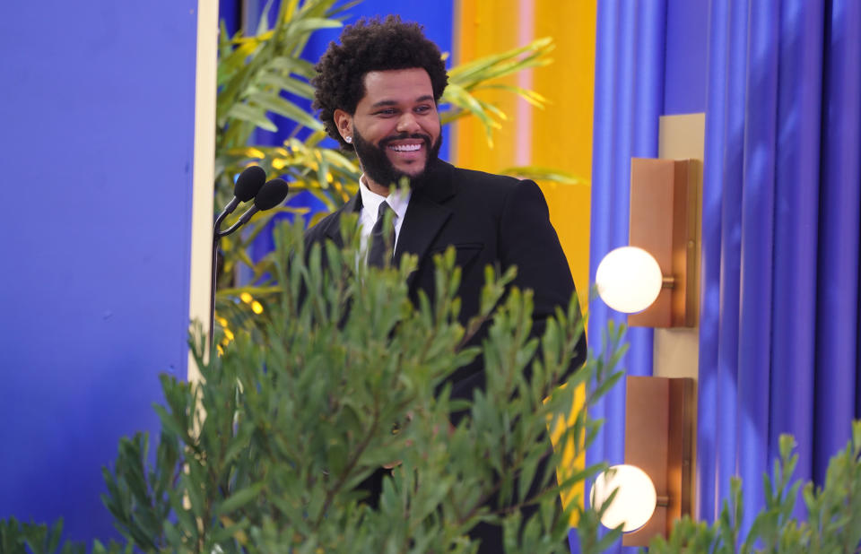 The Weeknd accepts the top hot 100 artist award at the Billboard Music Awards on Sunday, May 23, 2021, at the Microsoft Theater in Los Angeles. (AP Photo/Chris Pizzello)