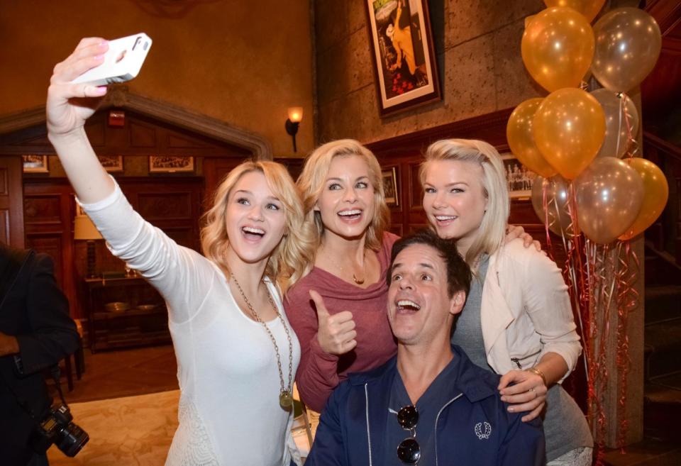 Hunter King, Jessica Collins, Christian Le Blanc and Kelli Goss pose for a selfie at "The Young and the Restless" 41st Anniversary, on Tuesday, March 25, 2014, in Los Angeles. (Photo by Tonya Wise/Invision/AP)