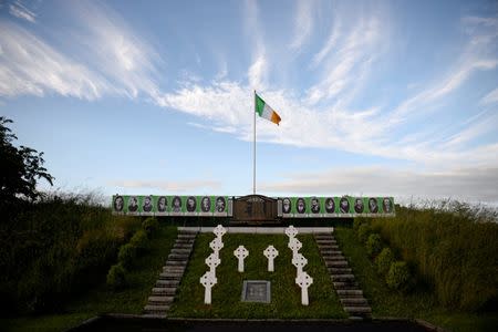 An Irish flag flies above a tribute to the 1981 H-Block hunger strikers, on a roadside near Crossmaglen, in Northern Ireland June 28, 2016. REUTERS/Clodagh Kilcoyne