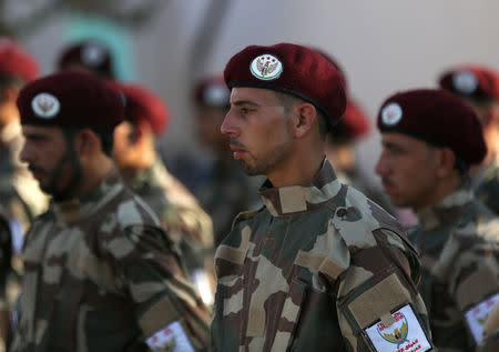 Fighters of National Army, backed by Turkey, take part during a graduation ceremony in the city of al-Bab, Syria August 5, 2018. REUTERS/Khalil Ashawi