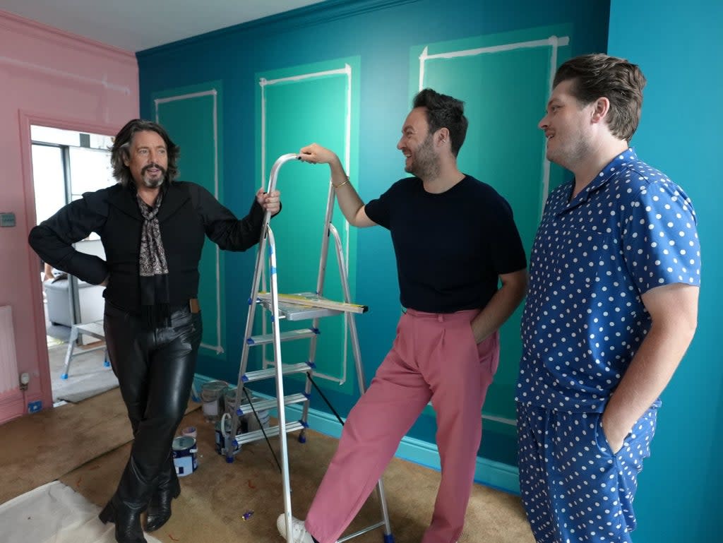 Part dandy highwayman, part sex dungeon captive: Laurence Llewelyn-Bowen amuses Jordan Cluroe and Russell Whitehead in the rebooted ‘Changing Rooms' (Channel 4)