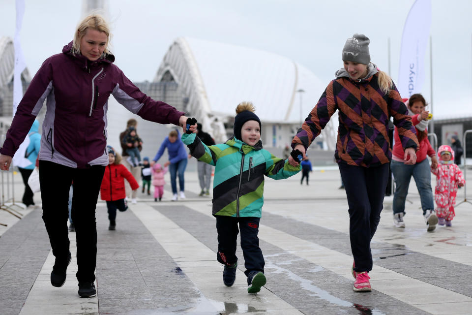 SOCHI, RUSSIA - MARCH 1, 2020: A family compete in the Pancake Run, the second event of Sirius Cup, at the Medals Plaza in Sochi Olymjpic Park on the final day of the Maslenitsa folk holiday. Pancakes are traditionally made and eated during Maslenitsa. Sirius Cup is a serius of races for professional athletes, amateurs, and children. Dmitry Feoktistov/TASS (Photo by Dmitry Feoktistov\TASS via Getty Images)