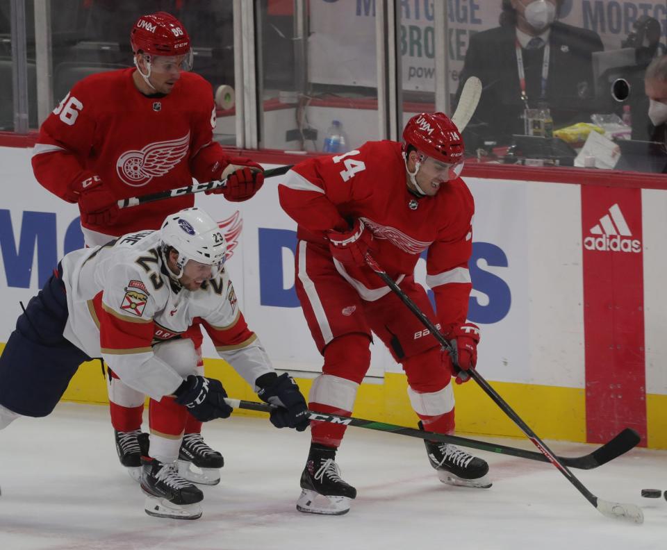 Detroit Red Wings center Robby Fabbri (14) skates against Florida Panthers center Carter Verhaeghe (23)  during first period action Friday, Feb. 19, 2021, at Little Caesars Arena in Detroit.