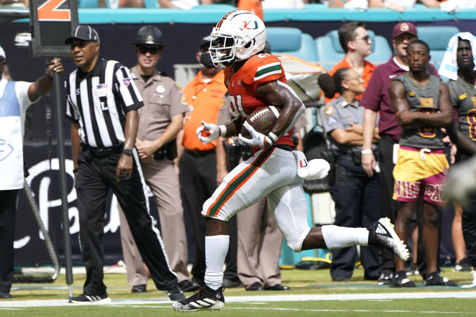 Miami running back Henry Parrish Jr. runs for a first down during the first half of an NCAA college football game against Bethune Cookman, Saturday, Sept. 3, 2022, in Miami Gardens, Fla. (AP Photo/Lynne Sladky)