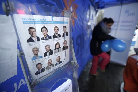 IRL party activists campaign near the supermarket in Tallinn February 19, 2015. REUTERS/Ints Kalnins