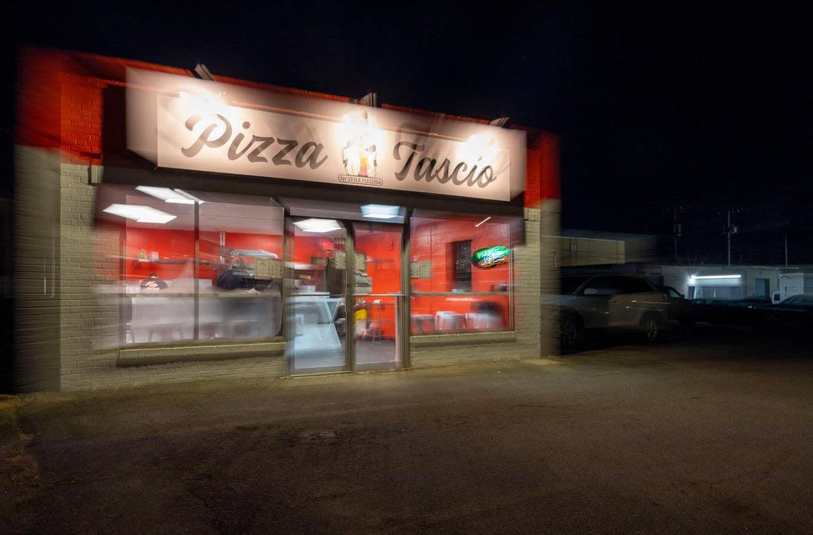 Shiny red walls adorn the inside of Pizza Tascio in North Kansas City.