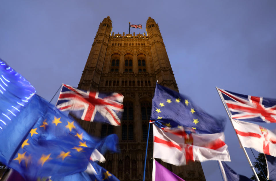 Flags flutter outside the Houses of Parliament in London, Britain, October 21, 2019. REUTERS/Simon Dawson