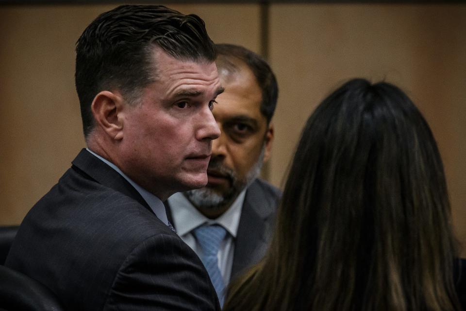 Timothy Ferriter, Jupiter, talks with his attorneys during his aggravated child abuse trial at the Palm Beach County Courthouse in downtown West Palm Beach, Fla., on October 3, 2023.