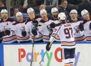 Oct 13, 2018; New York, NY, USA; Edmonton Oilers center Connor McDavid (97) is congratulated after scoring the game winning goal against the New York Rangers during the third period at Madison Square Garden. Mandatory Credit: Andy Marlin-USA TODAY Sports