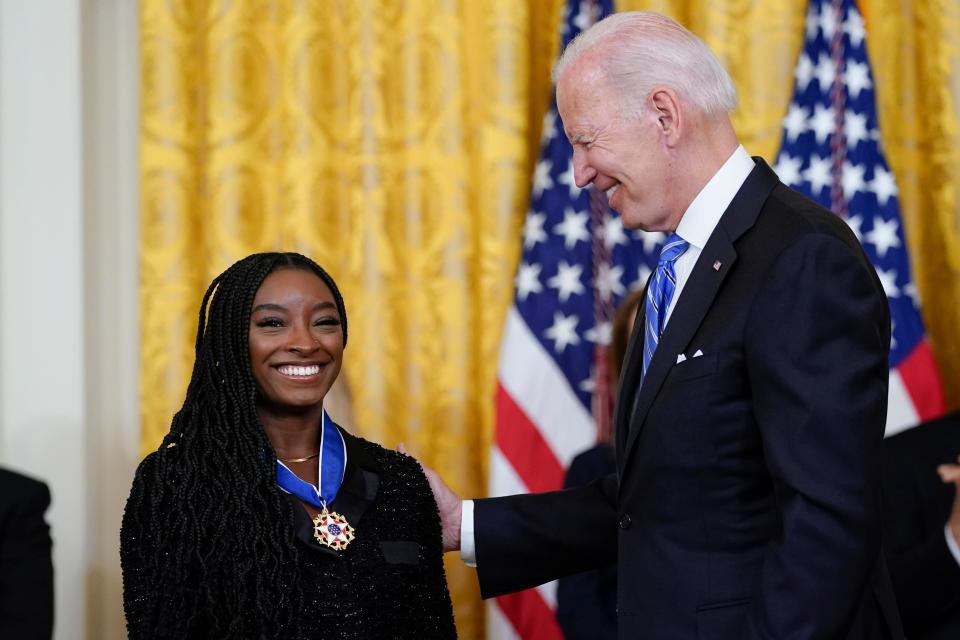 President Joe Biden awards the nation's highest civilian honor, the Presidential Medal of Freedom, to gymnast Simone Biles during a ceremony in the East Room of the White House in Washington, Thursday, July 7, 2022.