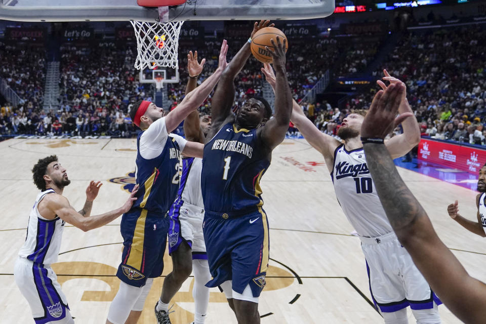 New Orleans Pelicans forward Zion Williamson (1) drives to the basket against Sacramento Kings forward Domantas Sabonis (10) in the second half of an NBA basketball game in New Orleans, Wednesday, Nov. 22, 2023. The Pelicans won 117-112. (AP Photo/Gerald Herbert)