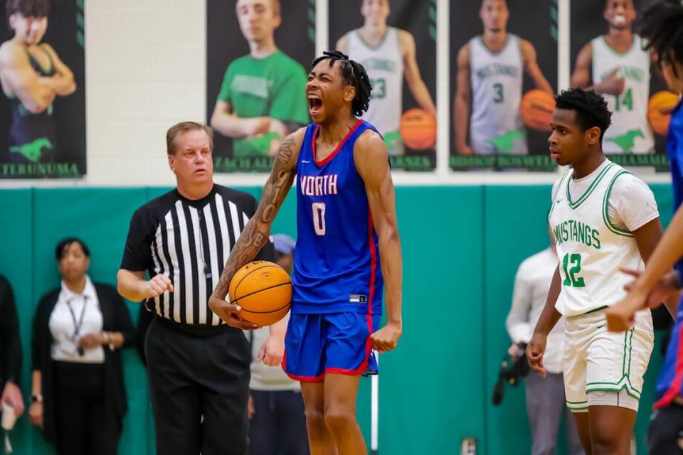 North Meck Isaiah Evans screams with excitement after leading him team to a comeback win over top national team Myers Park at the NCHSAA 4A state quarterfinals at Myers Park High School.