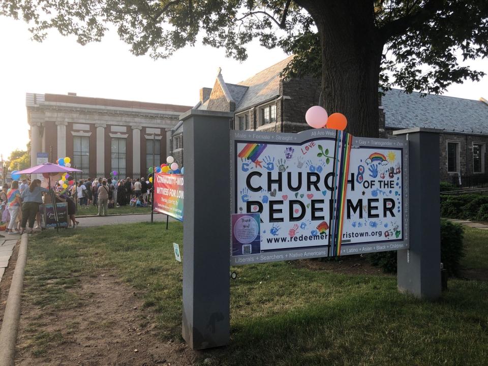 The redecorated welcome sign in front of the Church of the Redeemer in Morristown is displayed during the Witness for Love event on the church lawn Thursday, June 1, 2023.