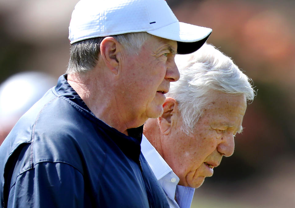 Bill Belichick walks and talks with owner Robert Kraft at the Gillette Stadium practice field. (John Tlumacki/The Boston Globe via Getty Images)