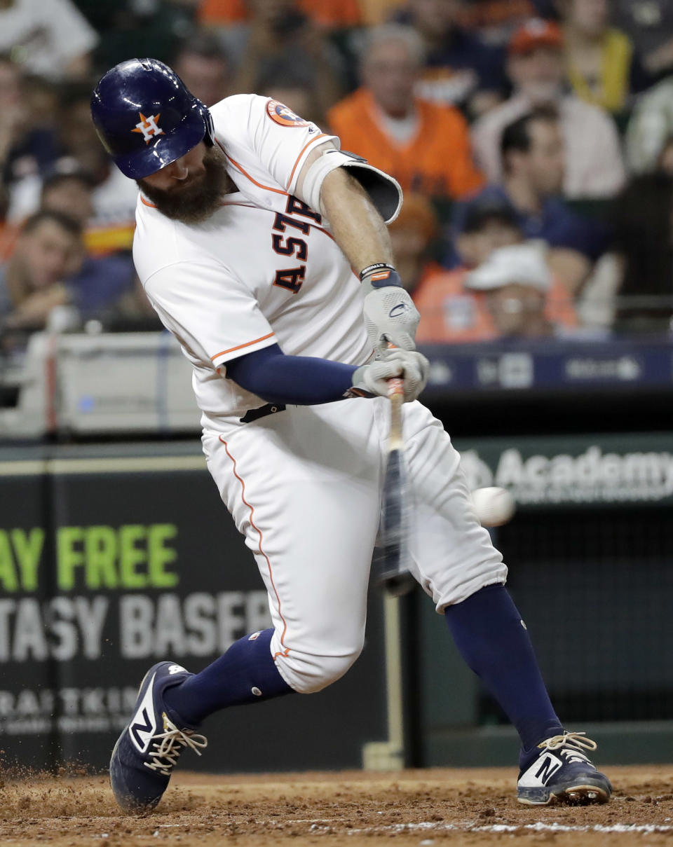 Houston Astros' Tyler White hits a two-run home run against the Colorado Rockies during the fifth inning of a baseball game Wednesday, Aug. 15, 2018, in Houston. (AP Photo/David J. Phillip)