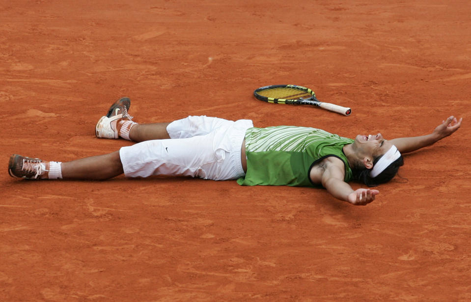 FILE - Spain's Rafael Nadal reacts as he defeats Argentina's Mariano Puerta during their final match of the French Open tennis tournament at Roland Garros stadium, Sunday June 5, 2005, in Paris. Nadal beat Puerta 6-7 (6), 6-3, 6-1, 7-5 to win. (AP Photo/Christophe Ena, File)