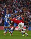 Arsenal's Per Mertesacker (C, front) celebrates his goal against Wigan Athletic during their English FA Cup semi-final soccer match at Wembley Stadium in London April 12, 2014. REUTERS/Eddie Keogh (BRITAIN - Tags: SPORT SOCCER)