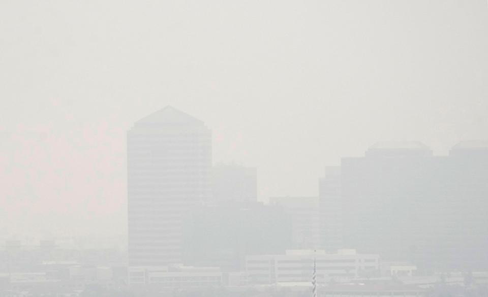 Fog disguises the skyline of central Phoenix after a winter storm passed through Arizona on Jan. 24, 2024.