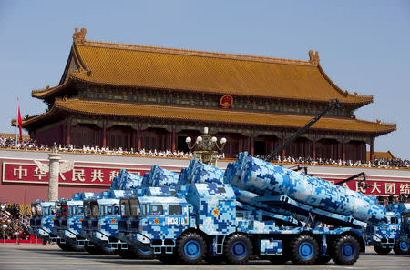 FILE PHOTO - Military vehicles carry DF-10 ship-launched cruise missiles as they travel past Tiananmen Gate during a military parade to commemorate the 70th anniversary of the end of World War II in Beijing Thursday Sept. 3, 2015. Andy Wong/Pool via REUTERS/File Photo