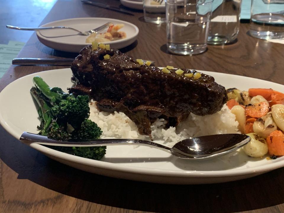 A serving of 24 Hour Short Rib Adobo, with roasted pearl onions, local jasmine rice, and preserved lemon at JEM, located at 644 Madison Ave. on April 24, 2024.