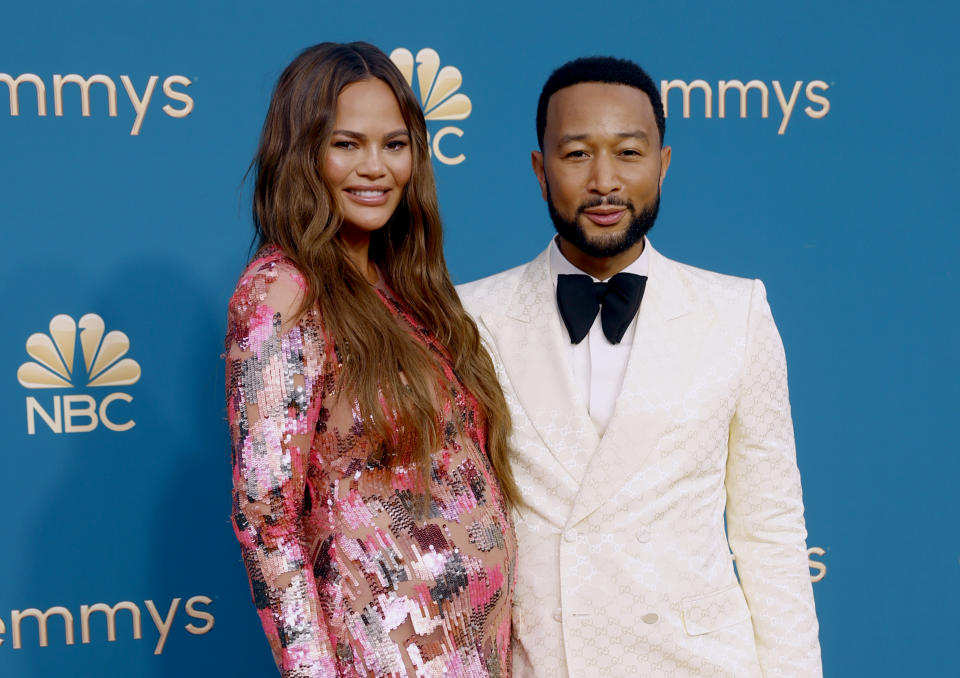 LOS ANGELES, CALIFORNIA - SEPTEMBER 12: 74th ANNUAL PRIMETIME EMMY AWARDS -- Pictured: (l-r) Chrissy Teigen and John Legend arrive to the 74th Annual Primetime Emmy Awards held at the Microsoft Theater on September 12, 2022. -- (Photo by Trae Patton/NBC via Getty Images)