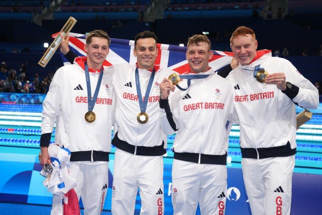 Duncan Scott, James Guy, Matt Richards and Tom Dean celebrate their Olympic gold medals