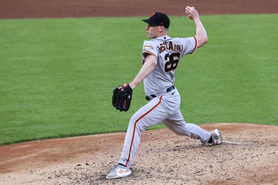 San Francisco Giants' Anthony DeSclafani throws during the second inning of a baseball game against the Cincinnati Reds in Cincinnati, Tuesday, May 18, 2021. (AP Photo/Aaron Doster)