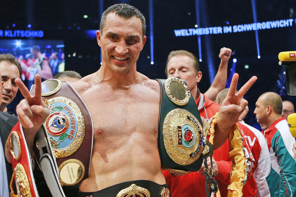 FILE - IBF, WBA, WBO and IBO champion Wladimir Klitschko, from Ukraine, celebrates after winning the IBF heavyweight world championships title bout against Bulgarian boxer Kubrat Pulev in Hamburg, Germany, Saturday, Nov. 15, 2014. Wladimir Klitschko will be inducted into the Boxing Hall of Fame in Canastota, N.Y., on Sunday, June 12, 2022. (AP Photo/Frank Augstein, File)