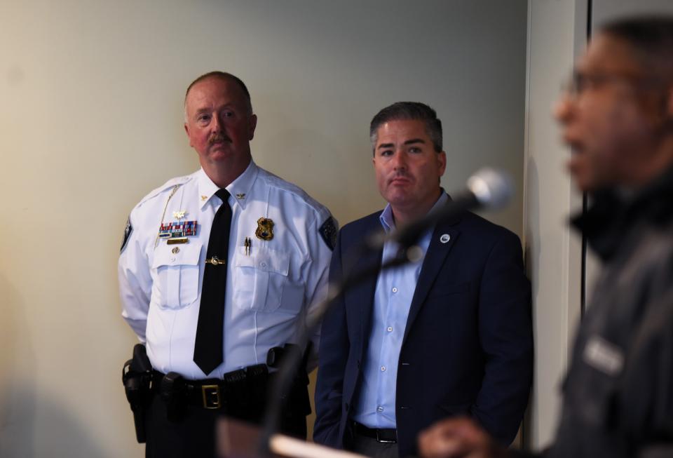 Port Huron Police Chief Joe Platzer, left, and City Manager James Freed watch on while Kevin Watkins, local NAACP president, speaks during a press conference on Tuesday, May 28, 2024.