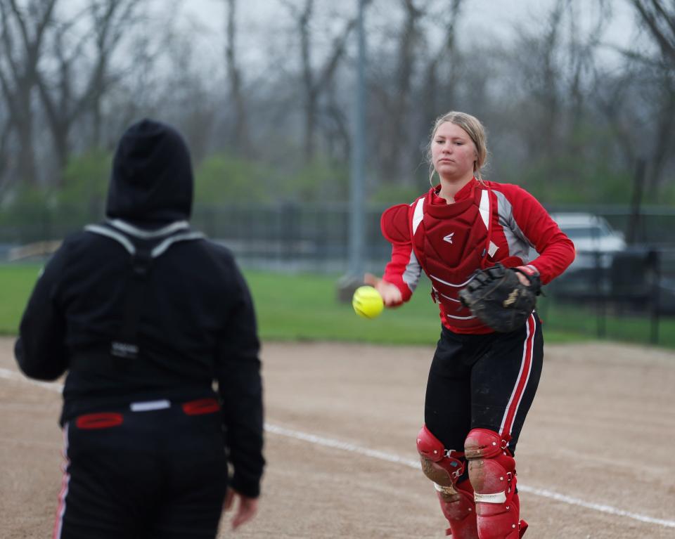 Richmond senior Madison Owens tosses a ball to her teammate during warmups before a game against Hagerstown April 16, 2022.