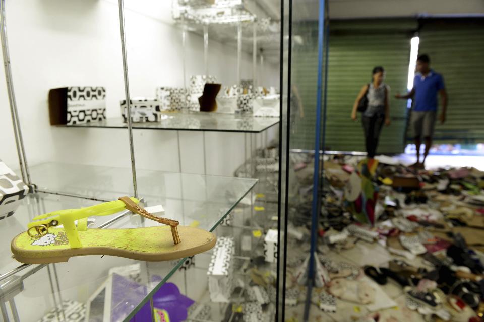 A view is seen inside a store that was looted during a police strike in Salvador, Bahia state, April 17, 2014. A police strike has unleashed violent crime in Brazil's third-largest city just two months before it is set to welcome hordes of soccer fans for the World Cup, adding to fears about the country's ability to ensure safety during the event. At least 22 people were killed in and around the northeastern city of Salvador after state police went on strike early on Wednesday to demand better pay and other benefits, the Bahia state government said on Thursday, prompting the federal government to dispatch troops to restore order. REUTERS/Valter Pontes (BRAZIL - Tags: CRIME LAW POLITICS CIVIL UNREST SPORT SOCCER WORLD CUP)